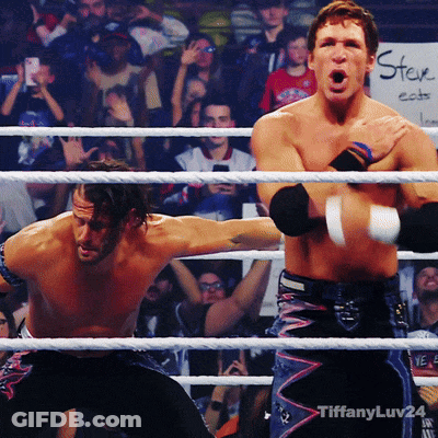 Two Wrestlers In A Ring With A Sign That Says ' Tiffanyluv24 ' On The Bottom GIF