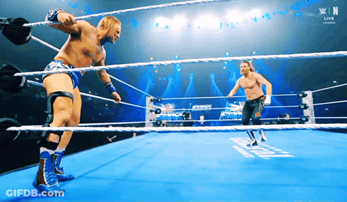 Two Wrestlers In A Ring With N On The Bottom GIF