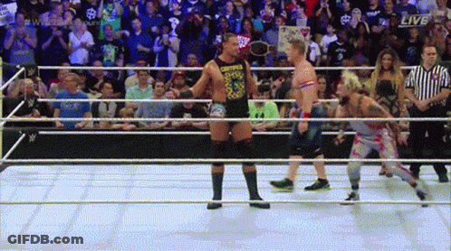 Two Wrestlers In A Ring With The Word Live On The Bottom GIF