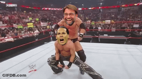 Two Wrestlers In A Wrestling Ring With A Wwe Logo On The Bottom GIF