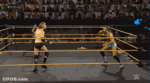 Two Wrestlers In A Wrestling Ring With The Hashtag # 205Live In The Background GIF