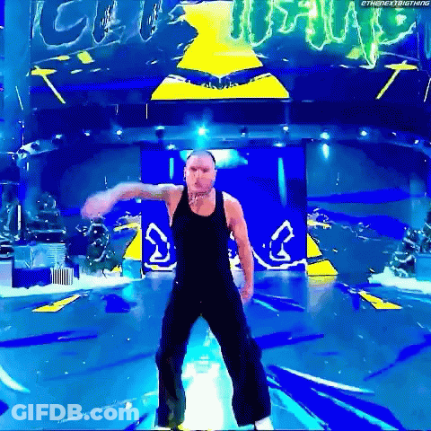 Two Wrestlers In Front Of Ladder Match Banner GIF