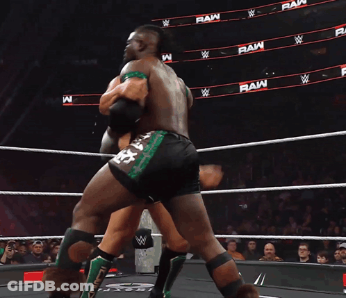 Two Wrestlers In Ring, Number 28 On Shorts GIF