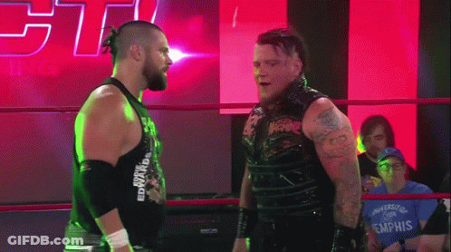 Two Wrestlers In Ring One Wearing Edward Tank Top GIF