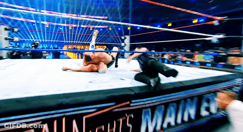 Two Wrestlers In Ring With All Nights Main Event Sign GIF