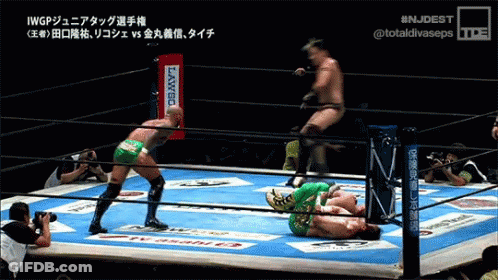 Two Wrestlers In Ring With Banco Sign GIF
