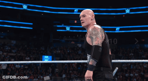 Two Wrestlers In Ring With Make A Whoop Dat Sign GIF
