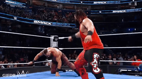 Two Wrestlers In Ring With Smack Down GIF