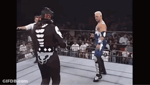 Two Wrestlers In Ring With Smack On Leg GIF