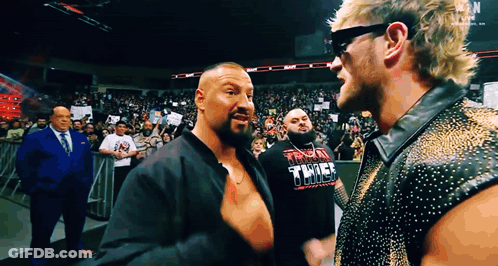 Two Wrestlers One Wearing Thunder Thunder Shirt GIF