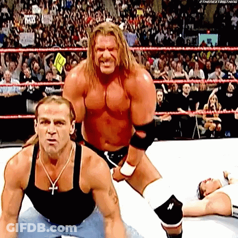 Two Wrestlers One With Cross Necklace GIF