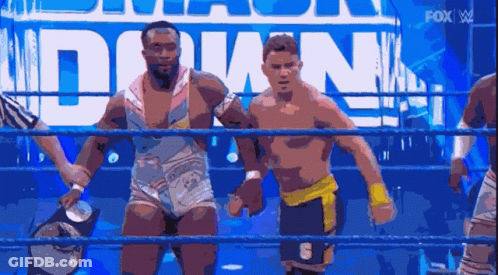 Two Wrestlers Standing In Ring GIF
