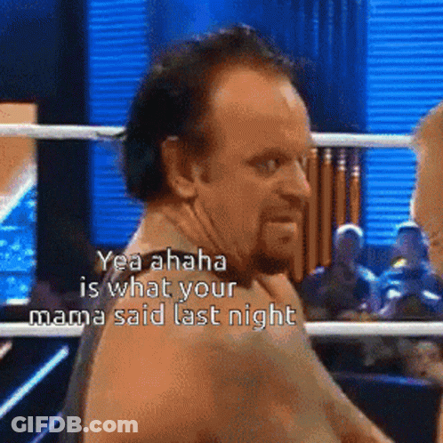 Two Wrestlers Standing Next To Each Other GIF