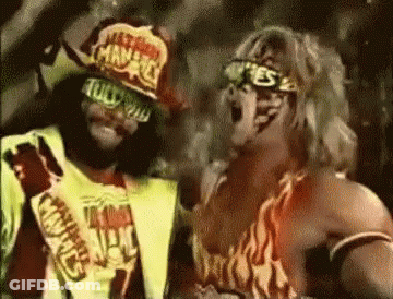 Two Wrestlers Standing Next To Each Other GIF