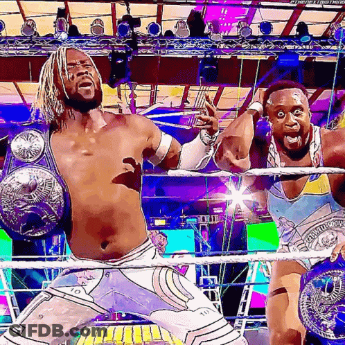 Two Wrestlers With Championship Belts GIF