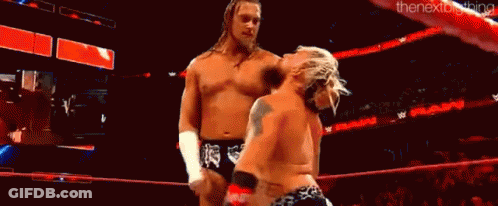Two Wrestlers Wrestling In Ring With Crowd GIF
