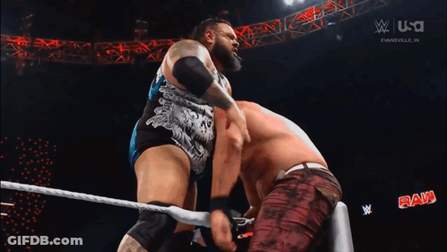 Two Wrestlers Wrestling In Ring With W GIF