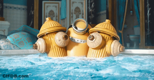 Two Yellow Fire Hydrants Are In A Bathtub GIF
