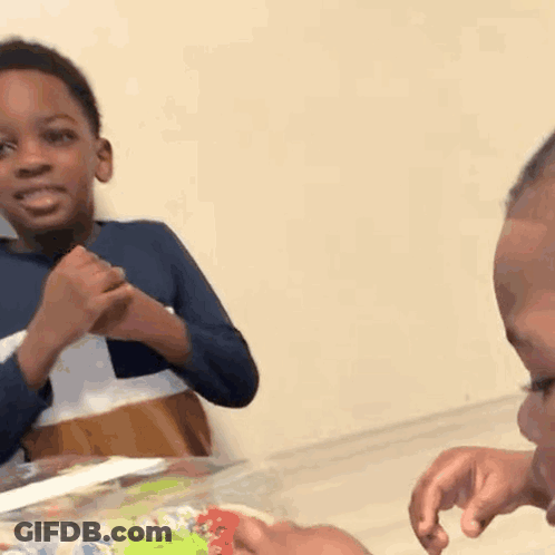 Two Young Boys Crying And Laughing GIF
