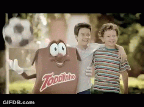 Two Young Boys Next To Toddynho Candy GIF
