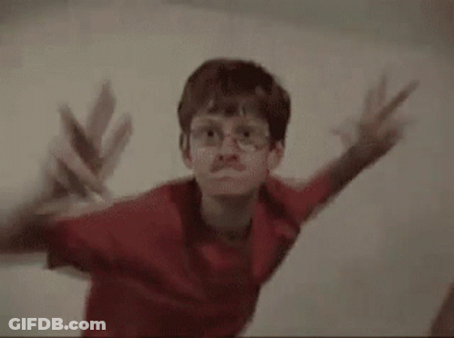 Two Young Boys Standing Next To Each Other GIF