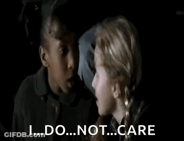 Two Young Girls Are Talking To Each Other In A Dark Room And One Girl Is Saying `` I ... Do ... Not ... Care '' . GIF