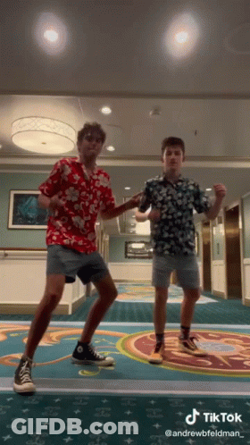 Two Young Men Are Dancing In A Hallway With A Tiktok Watermark On The Bottom GIF