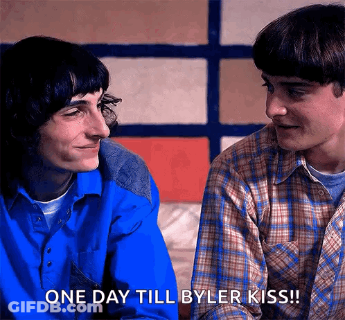 Two Young Men Are Looking At Each Other And One Of Them Is Saying One Day Till Byler Kiss . GIF