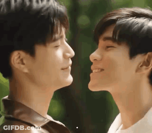 Two Men With Eyes Closed Looking At Each Other GIF