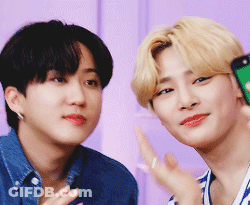 Two Young Men Are Posing For A Picture And One Is Holding A Cell Phone GIF