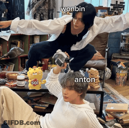 Two Men Posing One Has Winbin On Face GIF
