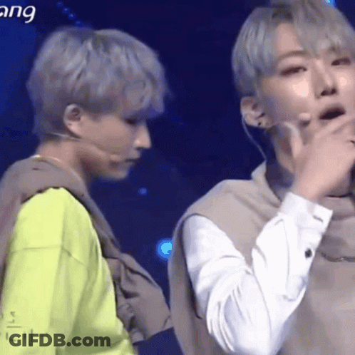 Two Men Standing On Stage GIF