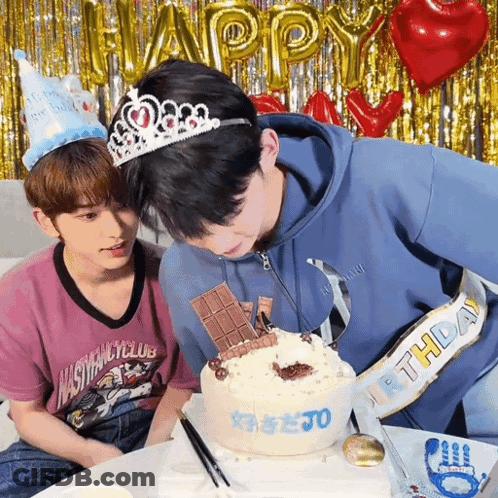 Two Young Men Celebrating Birthday With Cake And Balloons GIF