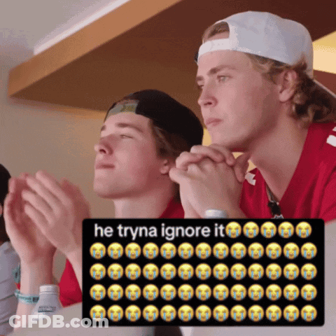 Two Young Men Clapping In Front Of He Tryna Ignore It Sign GIF
