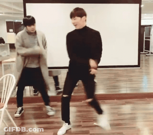 Two Young Men Dancing In Front Of Mirror GIF