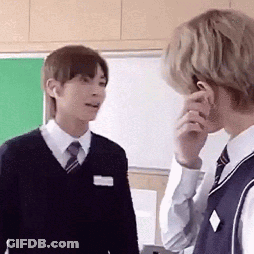Two Young Men In School Uniforms Talking GIF
