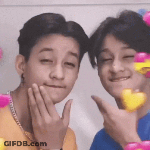 Two Young Men Making Faces GIF