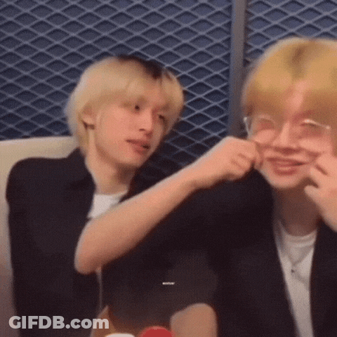 Two Young Men Making Funny Faces On Couch GIF
