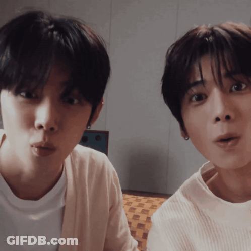 Two Young Men Making Funny Faces One In White Shirt GIF