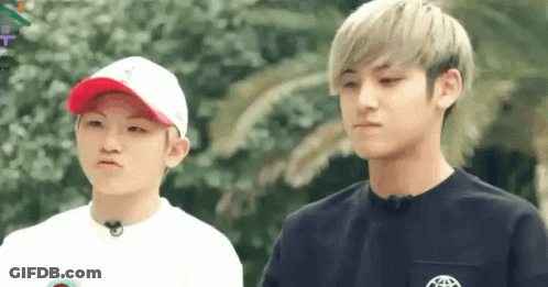 Two Young Men Making Funny Faces One With Hat GIF