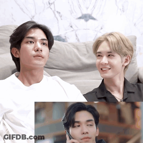 Two Young Men On Couch One Talking On Phone GIF