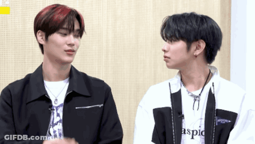 Two Young Men One Wearing Aspic Shirt GIF