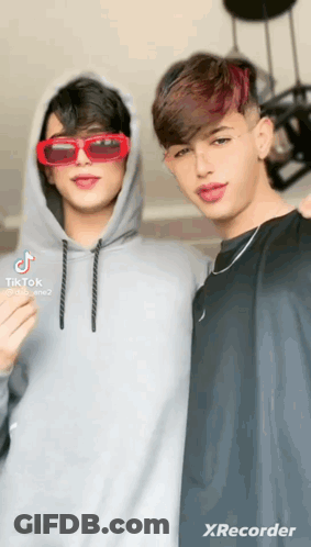 Two Young Men Posing For Picture GIF
