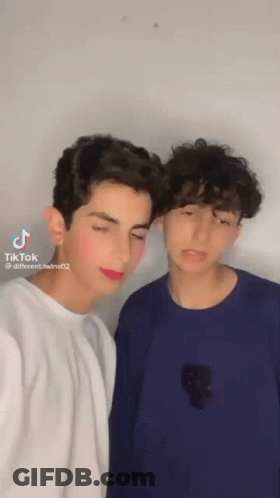 Two Young Men Posing For Picture With TikTok Watermark GIF