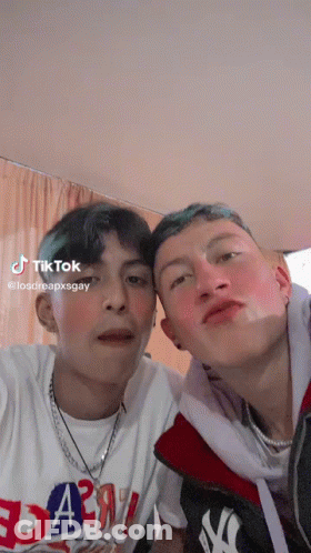 Two Young Men Posing One In Yankees Jacket GIF
