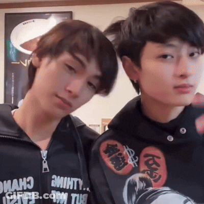 Two Young Men Posing One Wearing Hoodie Saying Almost GIF