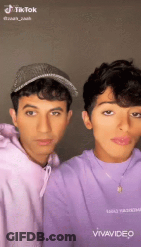 Two Young Men Posing Together GIF