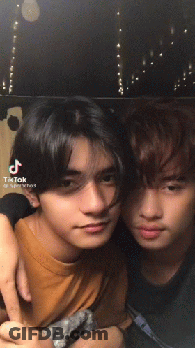 Two Young Men Posing With TikTok Text GIF