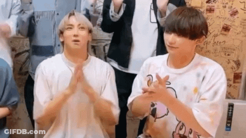 Two Young Men Sitting And Clapping GIF