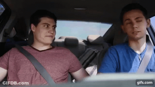 Two Young Men Sitting In Car With Seat Belts GIF
